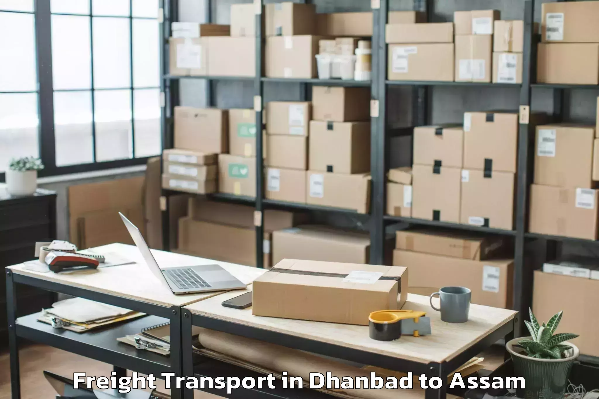 Easy Dhanbad to Borjhar Airport Gau Freight Transport Booking